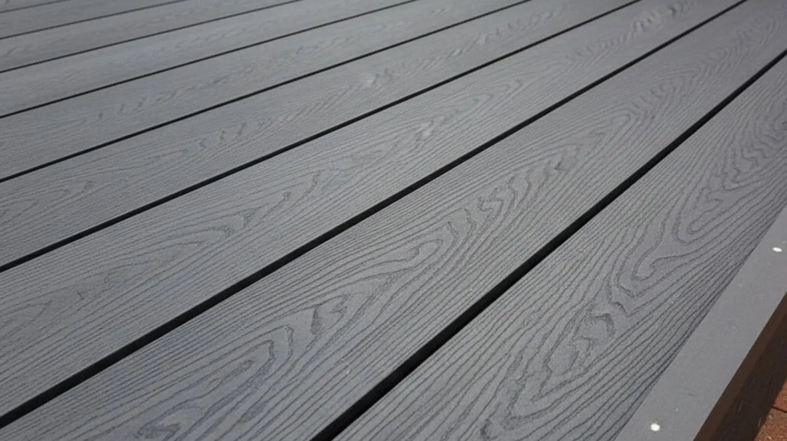 Family garden with artificial grass, a play teepee and a fire pit seating area