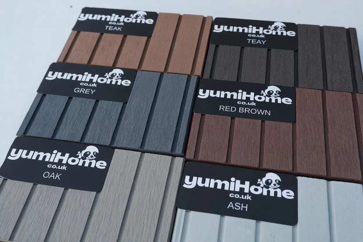 Composite decking sample boards in teak, grey, oak, red brown and ash with yumiHome labels