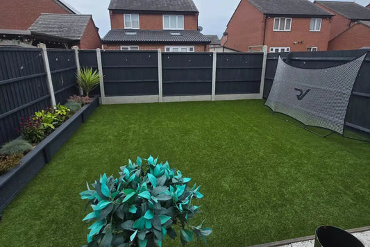 An enclosed garden laid with artificial grass